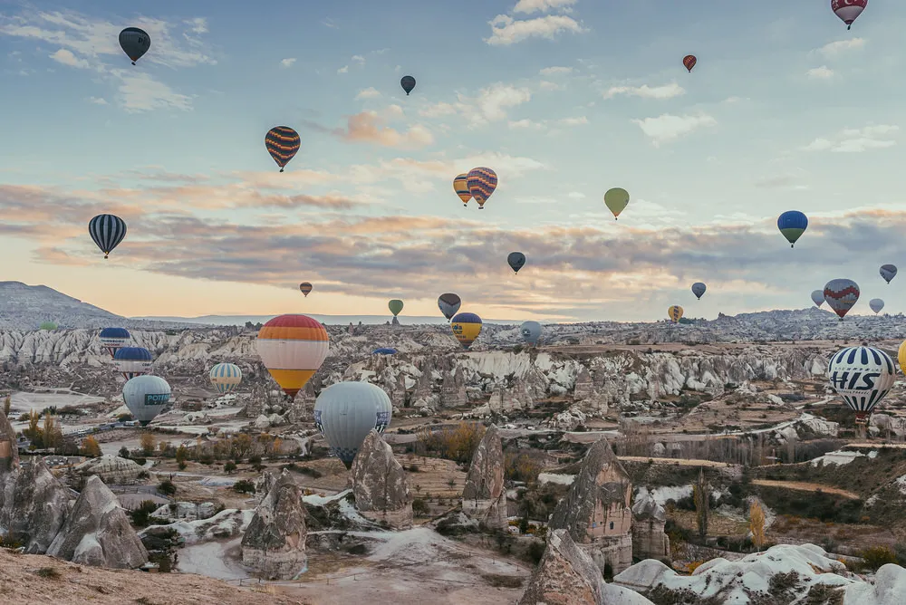 Hot-air balloons drifting over the Cappadocia valleys