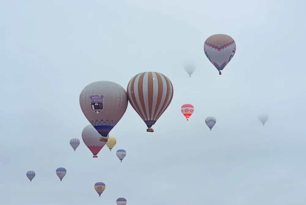 Couple watching the balloons rise in Cappadocia