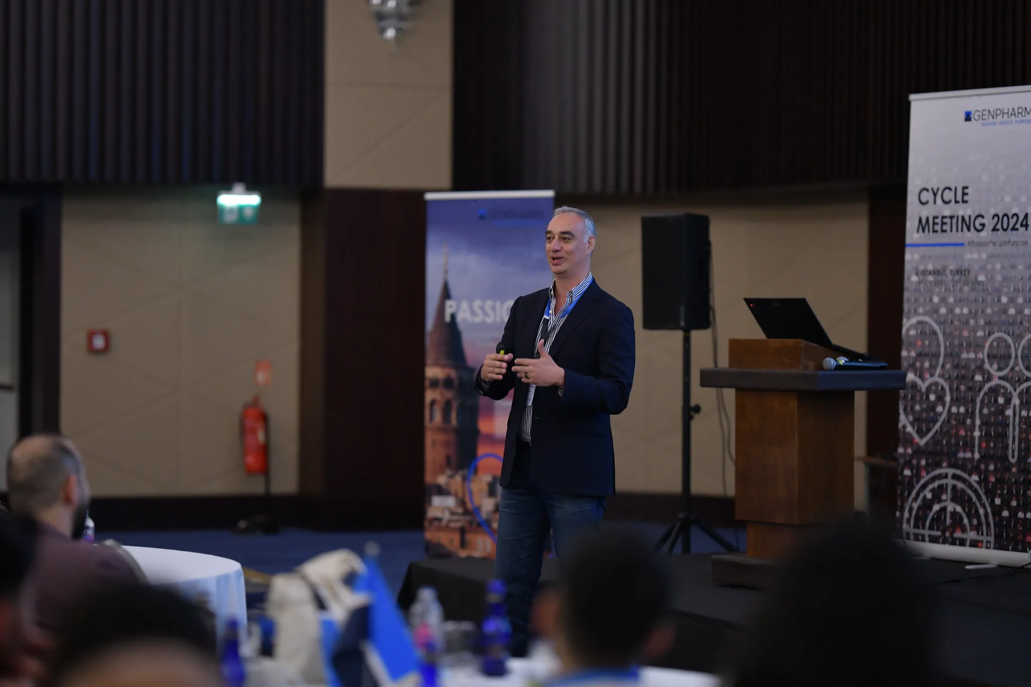 Keynote speaker presenting on stage at an Istanbul conference